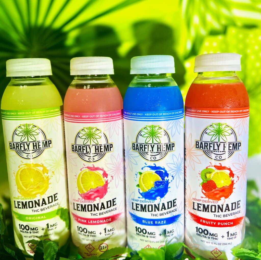Assorted Barfly THC lemonades in front of a green background